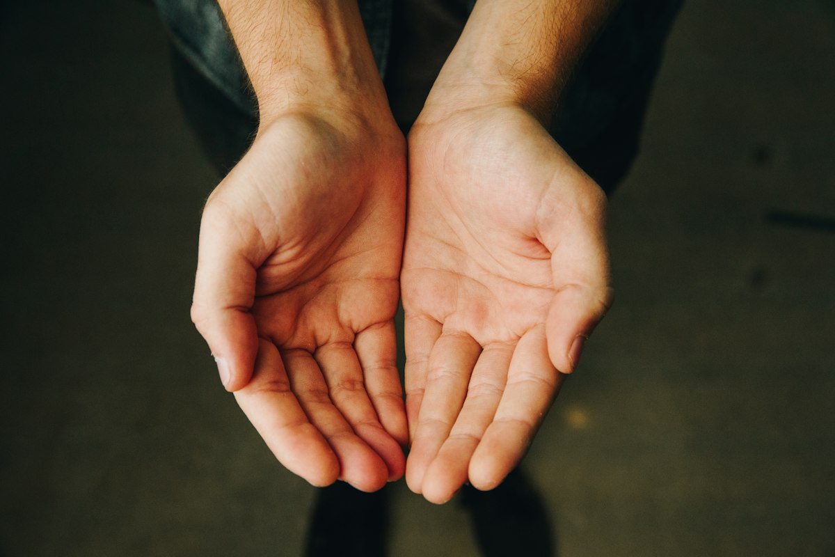 Two open hands held together, palms up